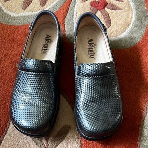 Alegria Shiny Black Textured Loafers